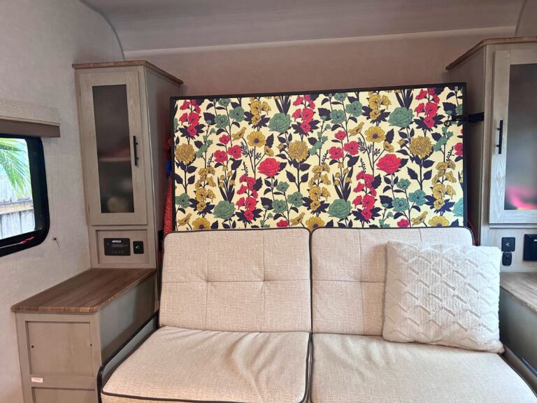 Floral wallaper accent wall in RV travel trailer.